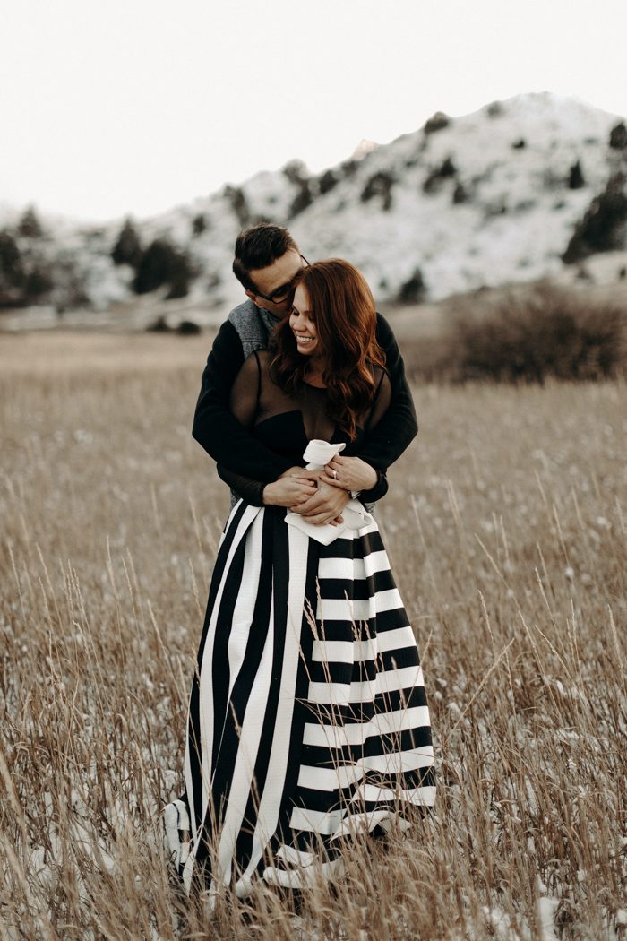 couple embracing with striped skirt