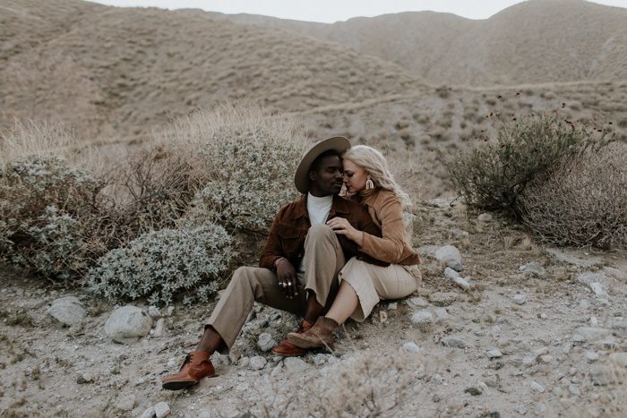 couple sitting in the desert