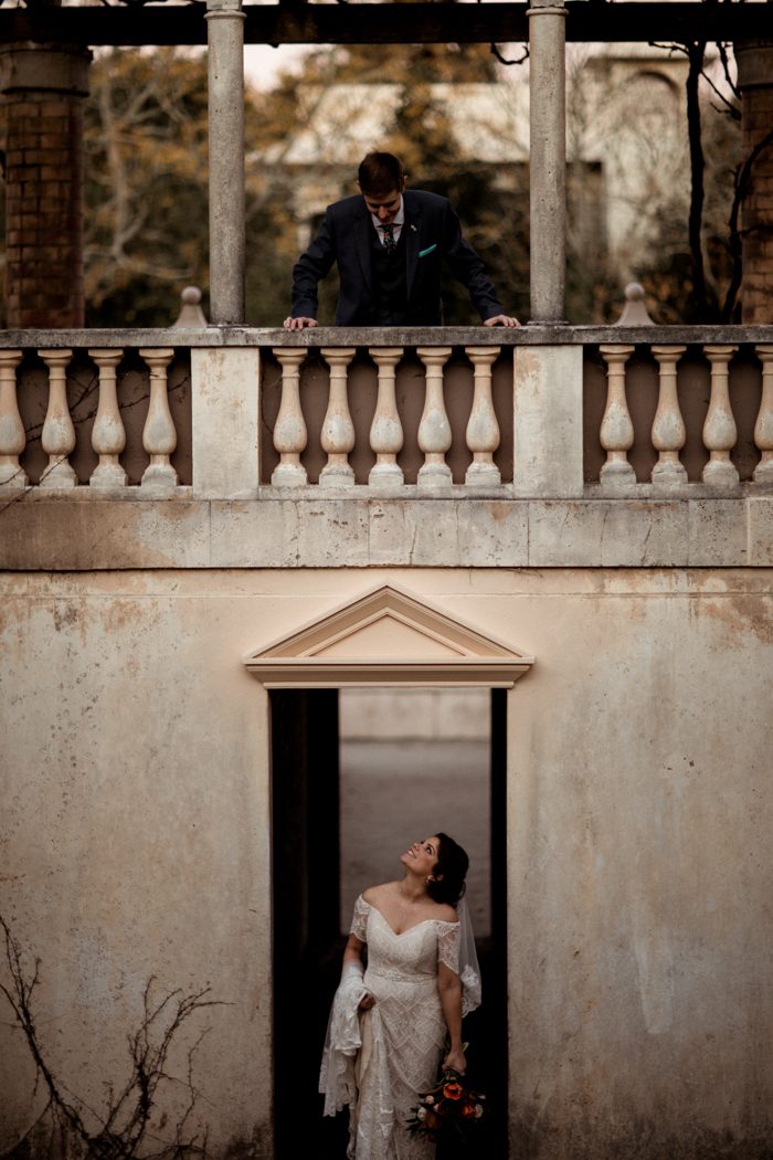 bride and groom standing on a catwalk