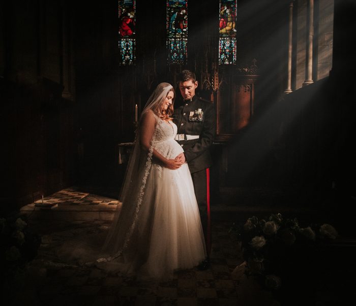 bride and groom with stained glass