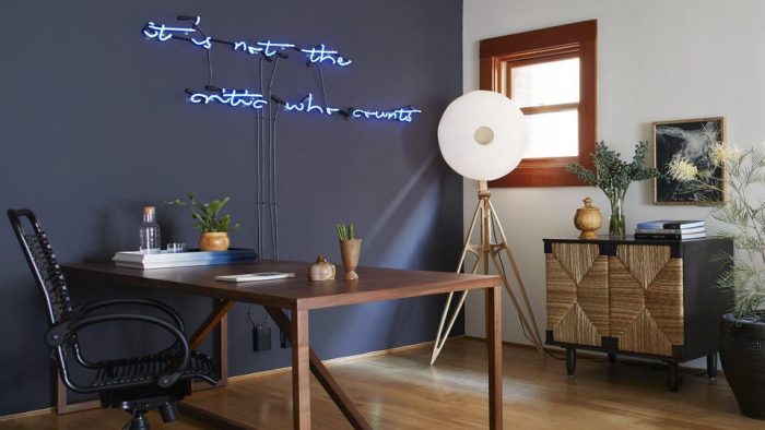 office with neon sign on wall