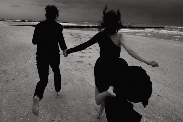black and white running engagement photo