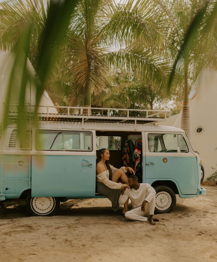 couple on beach in vintage VW bus