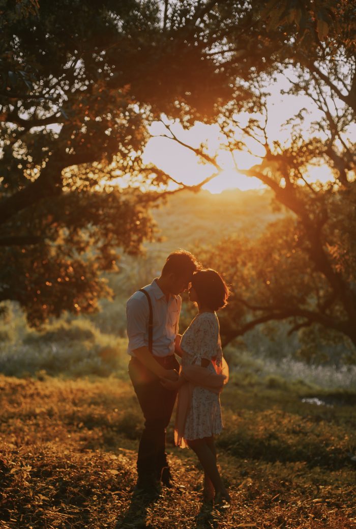 golden hour couple under trees top pic