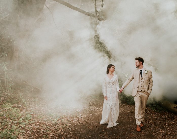 top pic of month couple walking through fog