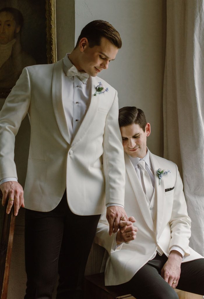 same sex couple in white tux jackets
