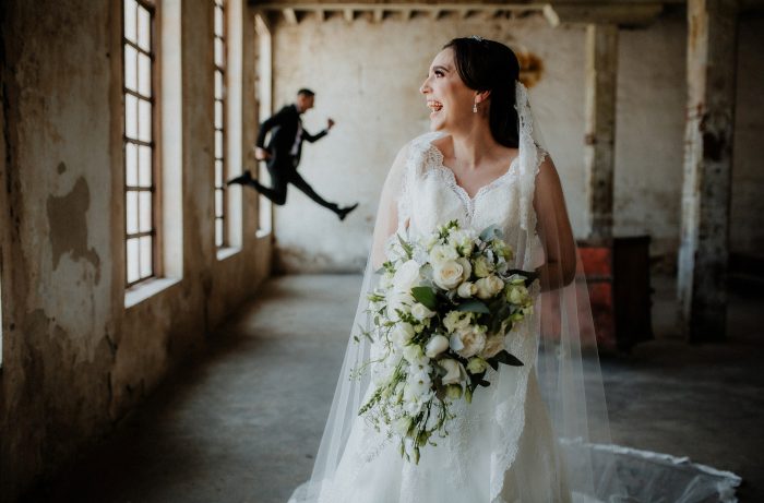 bride laughing and jumping groom