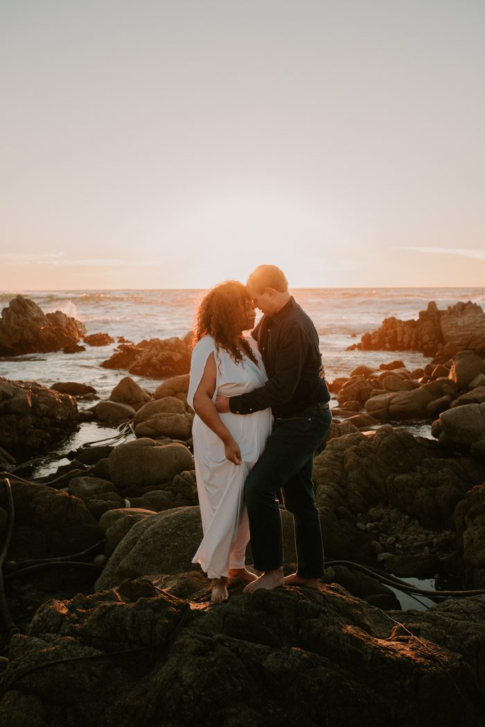 diverse couple standing near seaside