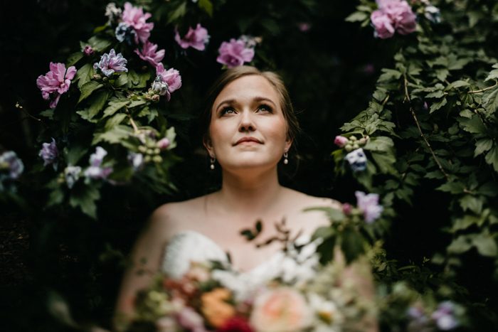 bride surrounded by flowers 