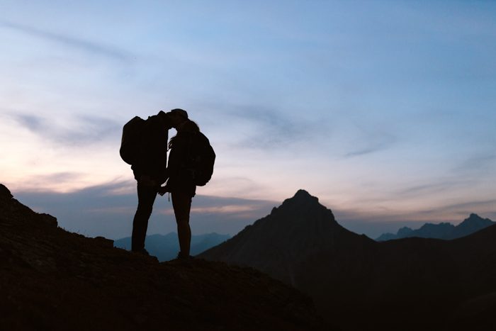 adventurous hiking couple after sunset