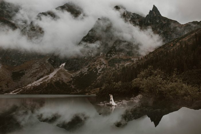 couple landscape shot mountains and fog