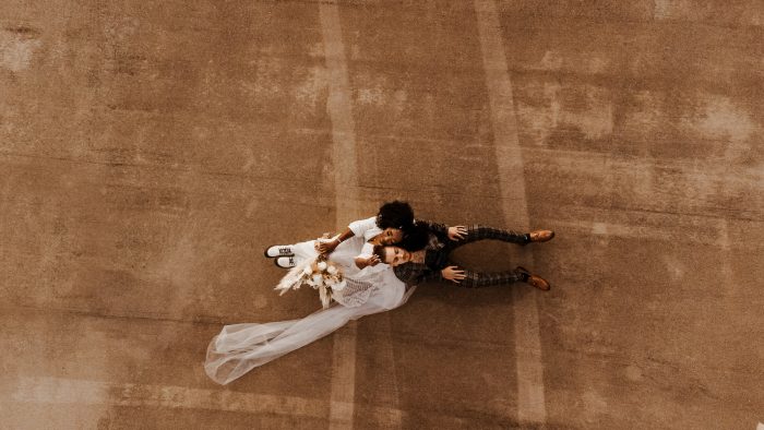 aerial shot of wedding day couple in parking lot