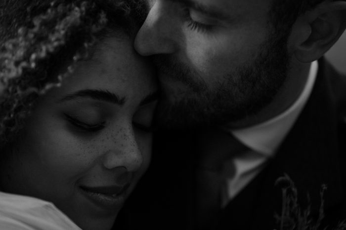 up close intimate black and white portrait of couple