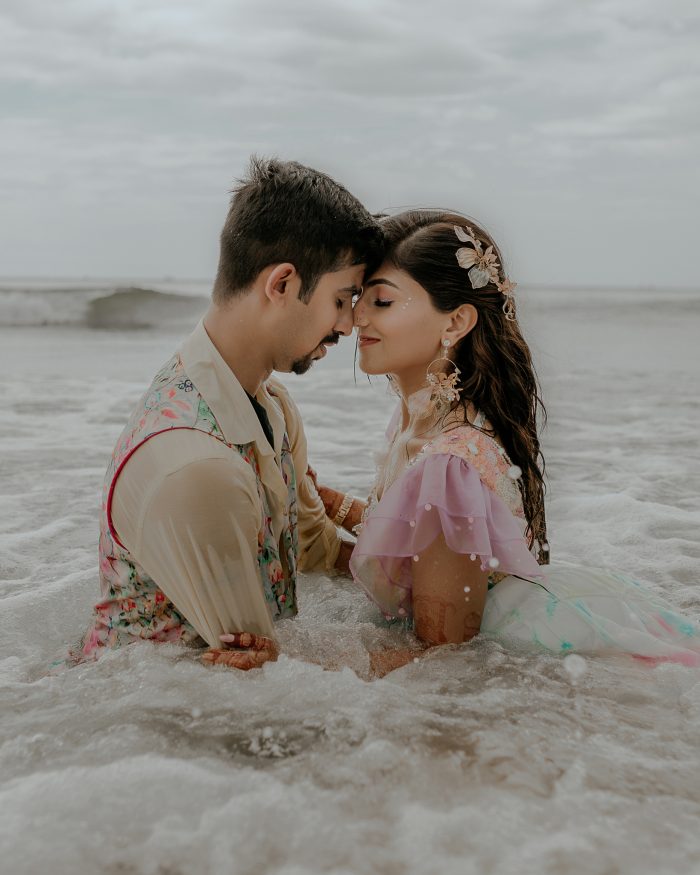 couple kissing in ocean in Goa, India