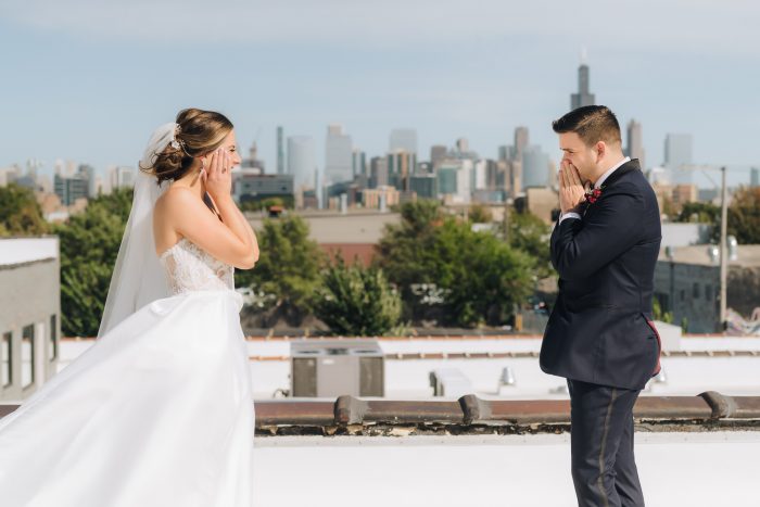 bride and groom first look on city rooftop