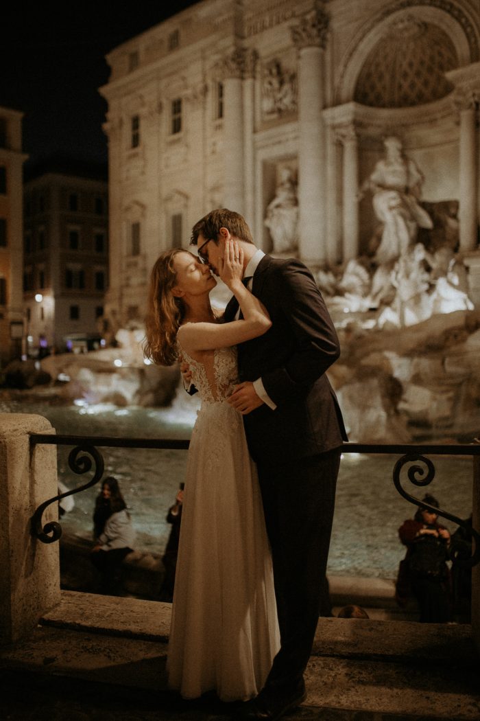 eloping couple portrait in front of Trevi Fountain