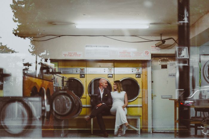 wedding day couple inside laundromat