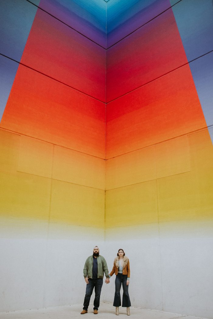 engagement photo couple by colorful mural