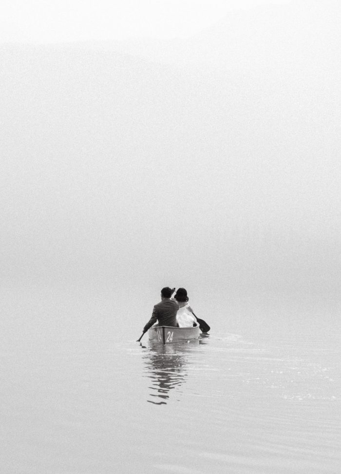 eloping couple kayaking in smog from wildfire