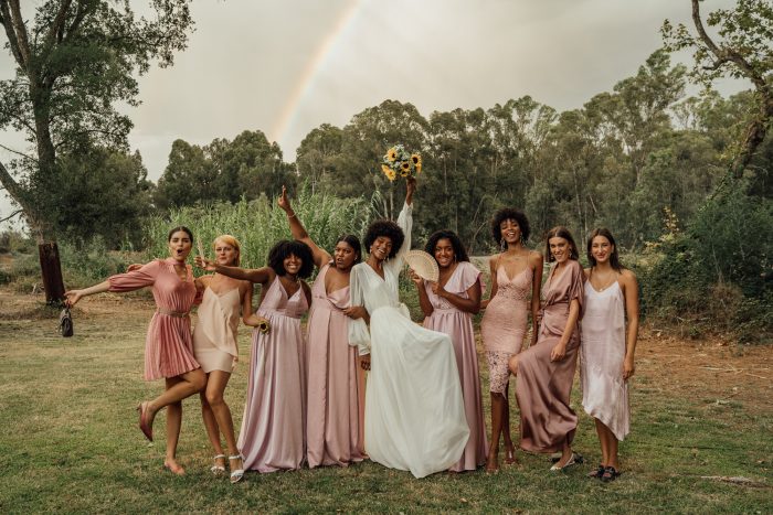 casual wedding group photo bridesmaids and rainbow