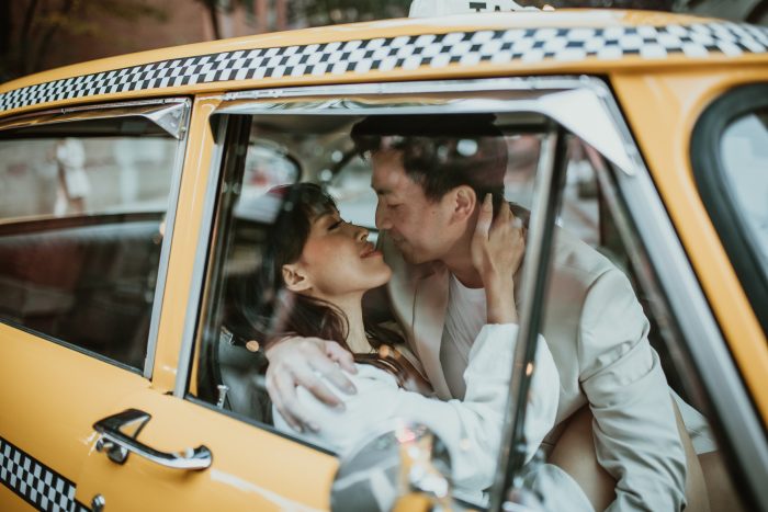couple in NYC vintage taxi cab