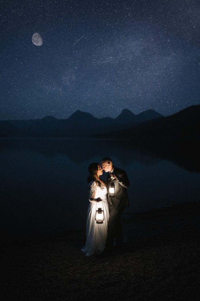 night time portrait wedding couple under stars with lanterns