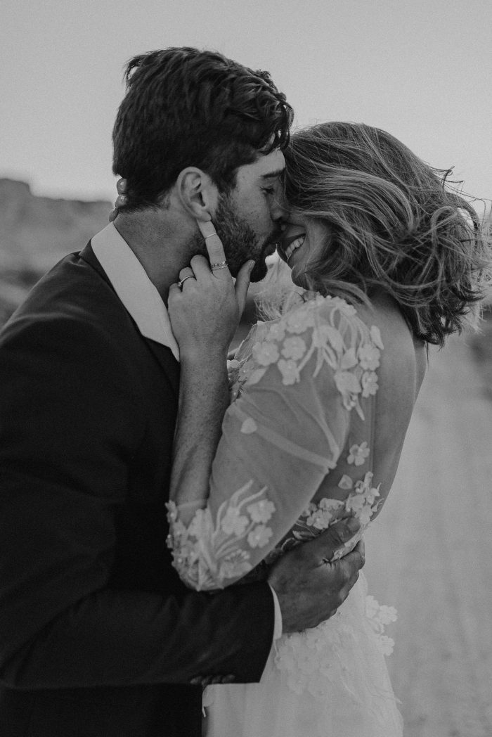 black and white bride and groom kissing