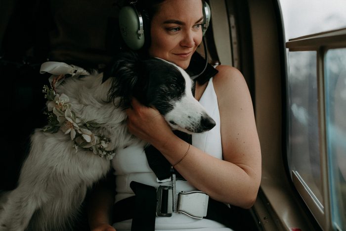 bride in helicopter with her dog