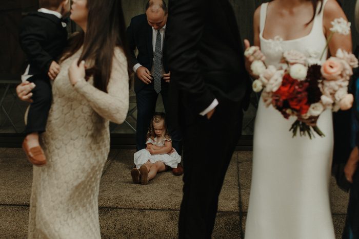 little girl pouting at wedding