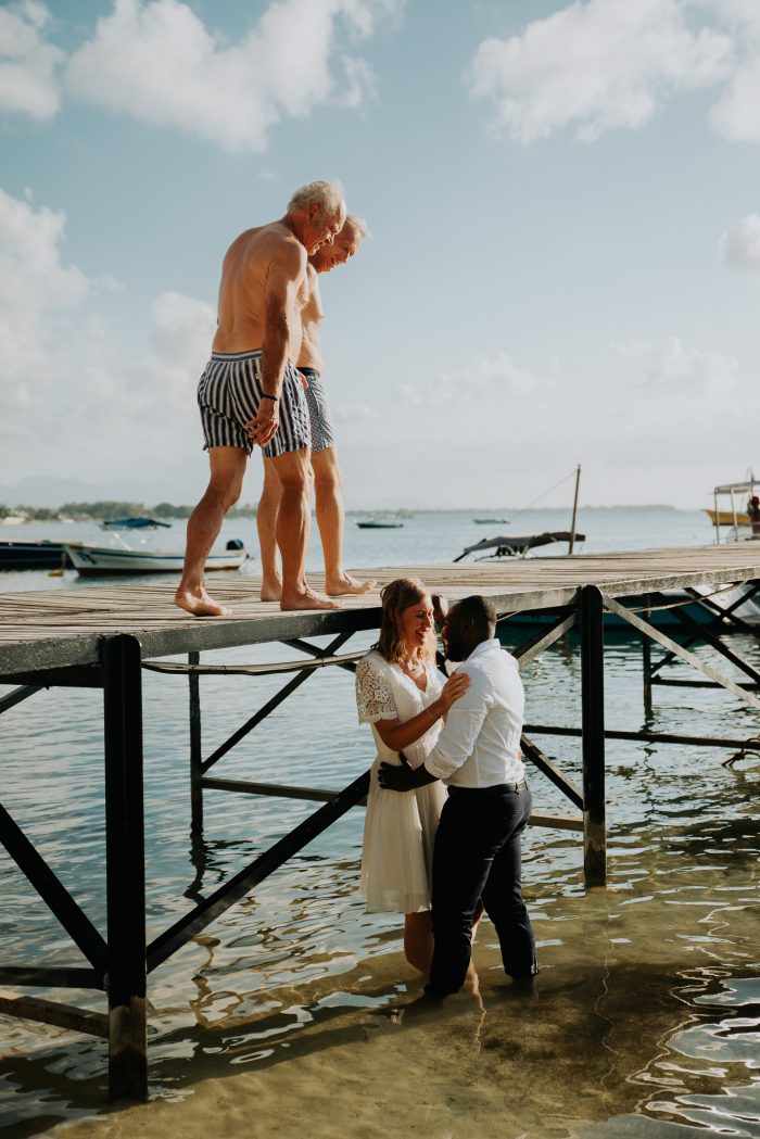 funny engagement photo on a pier