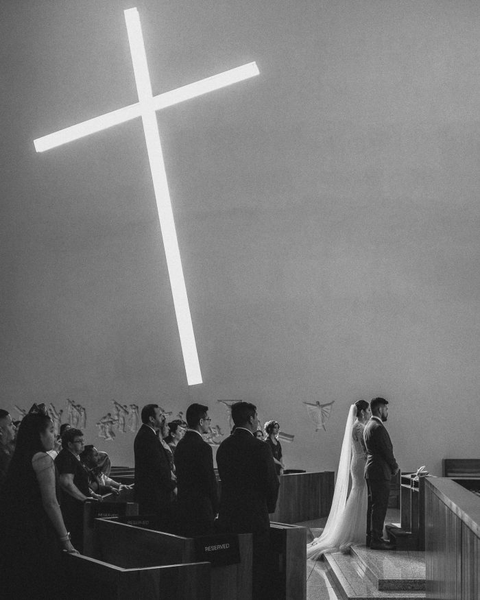 cross projected onto church wall during ceremony