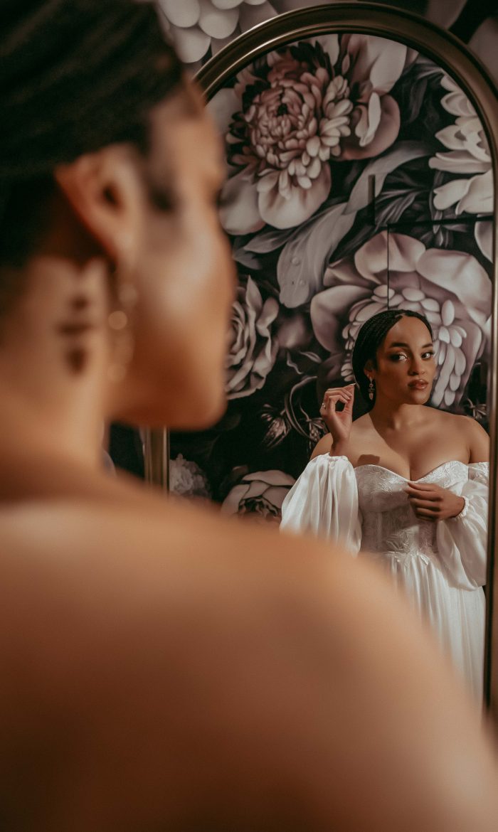 bride getting ready in front of a mirror