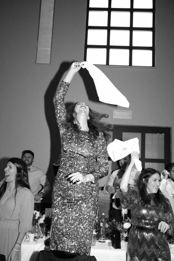 joyful wedding wedding guest swinging napkin