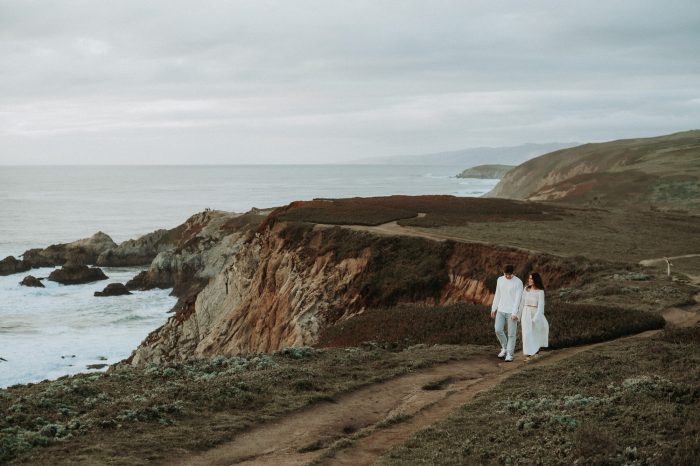 top pics couple walking on rocky coast