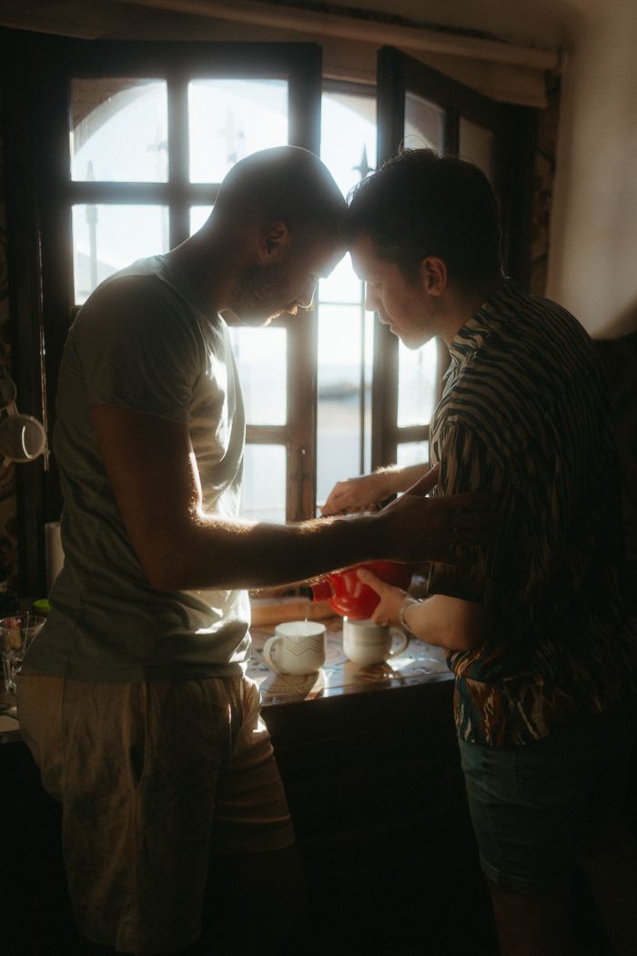same-sex couple making coffee together 