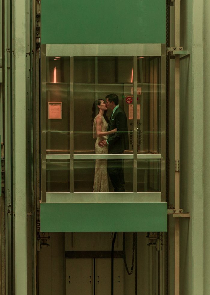 wedding day couple in a green elevator