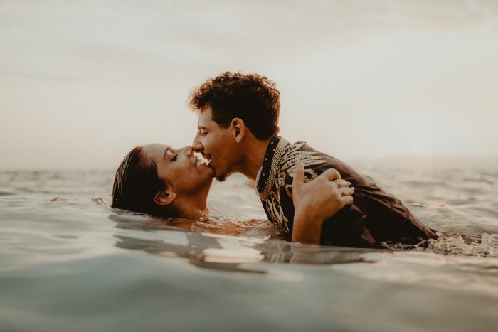 couple kissing in the water