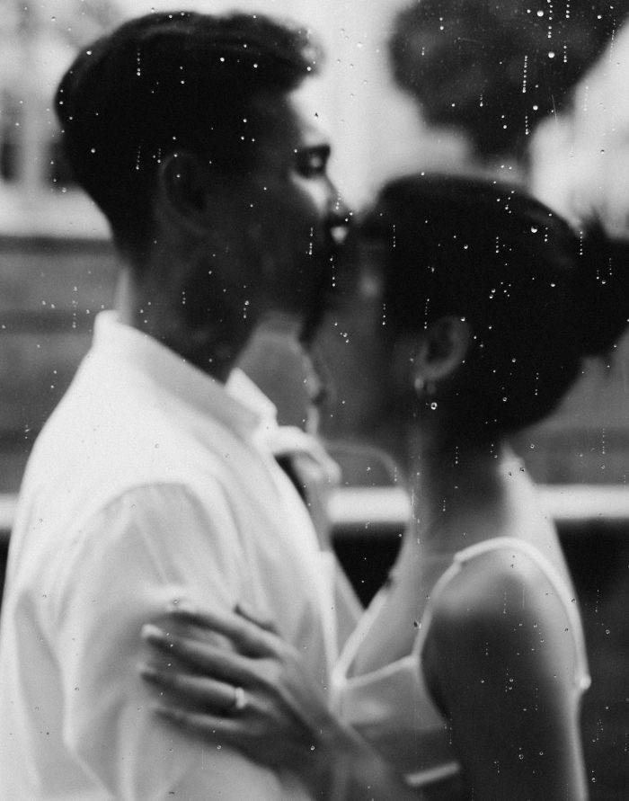 black and white portrait of couple with raindrops