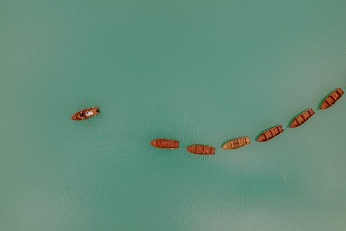 drone photo of a couple in a row boat