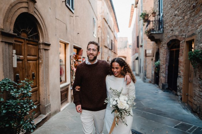 elopement couple walking in Tuscany