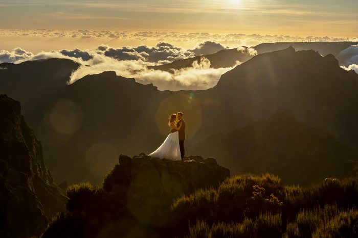 wedding portrait on mountaintop above clouds