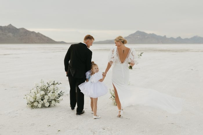 wedding couple with their daughter