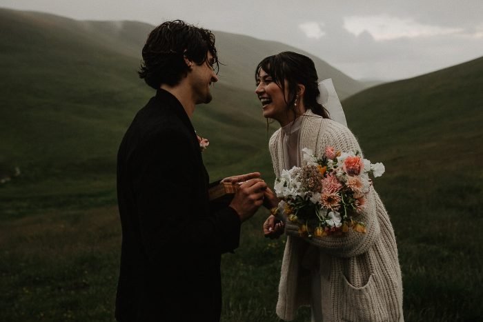 elopement couple laughing in the rain