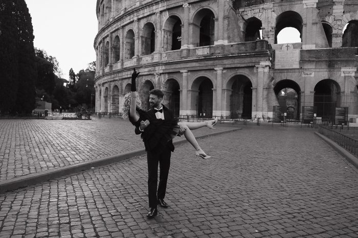 black and white photo couple in front of Colosseum 