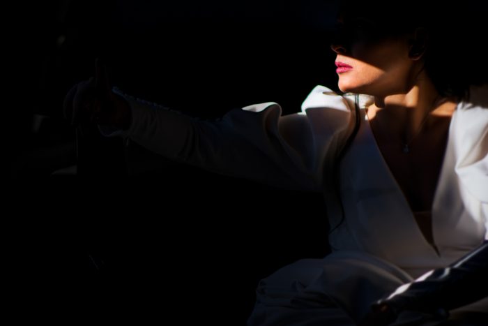 bride in the shadows of a car