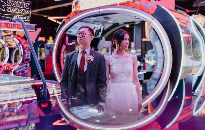 wedding couple in an arcade