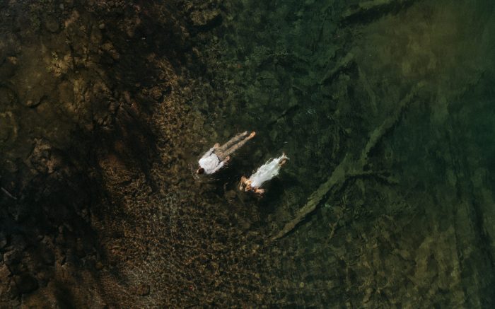 wedding couple swimming in water