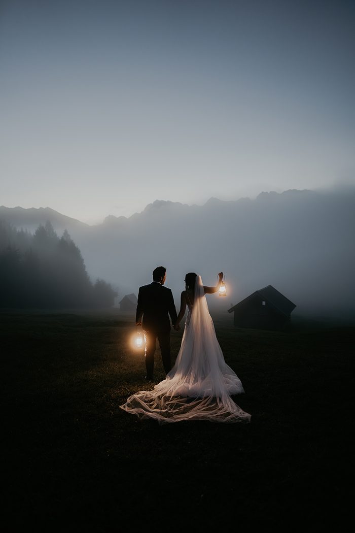 wedding couple holding lanterns 