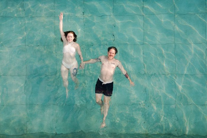 couple swimming in swimming pool