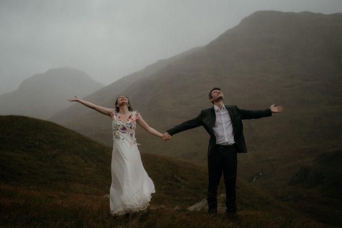 bride and groom in the rain